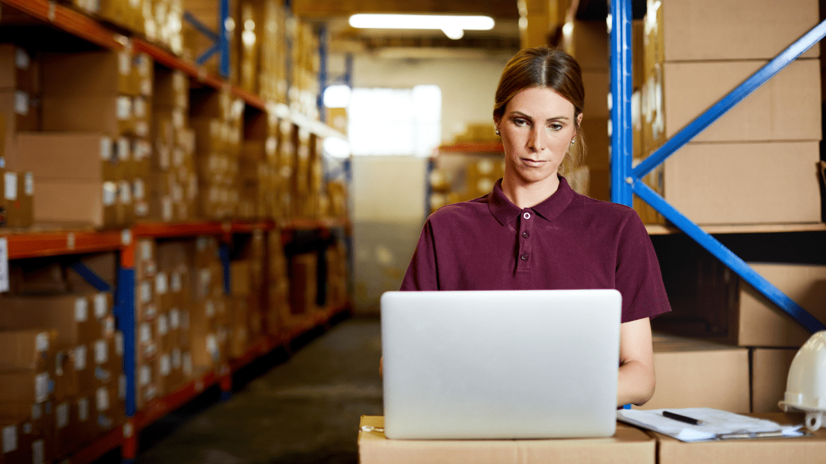 woman working on computer to verify supplier records